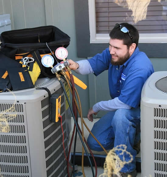 pittman tech working on hvac unit